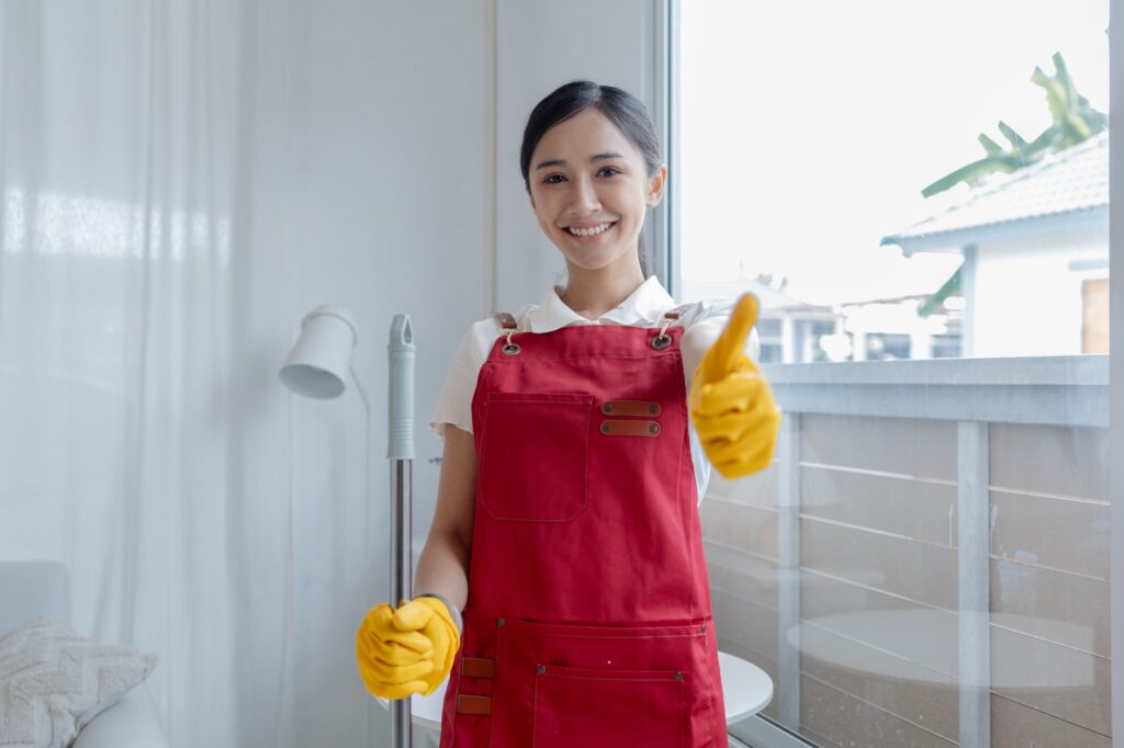 Asian woman cleaning staff, company office cleaning maid, maintaining cleanliness in the office. Cle